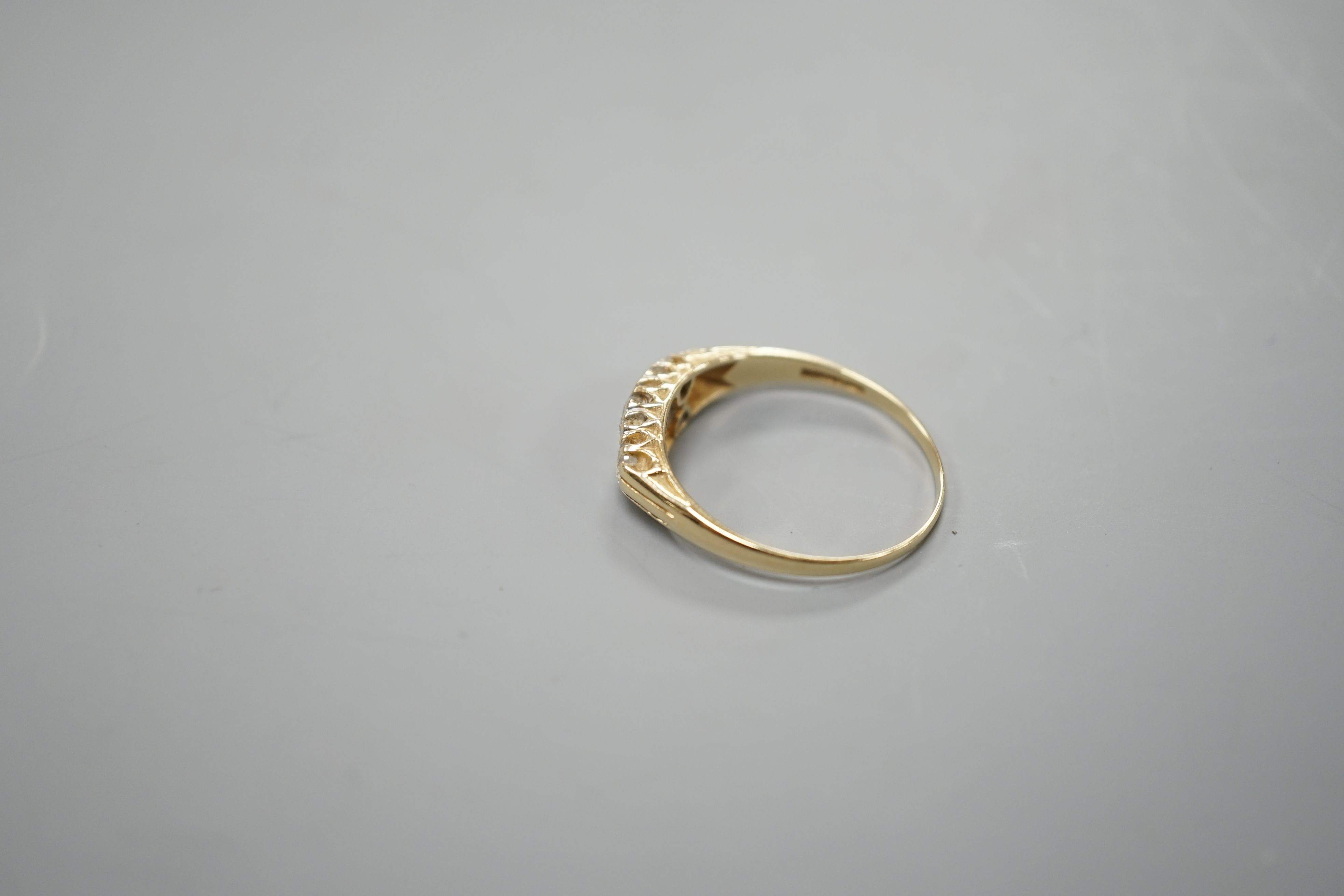 An 14ct gold and diamond dress ring, size T, gross 3.2 grams